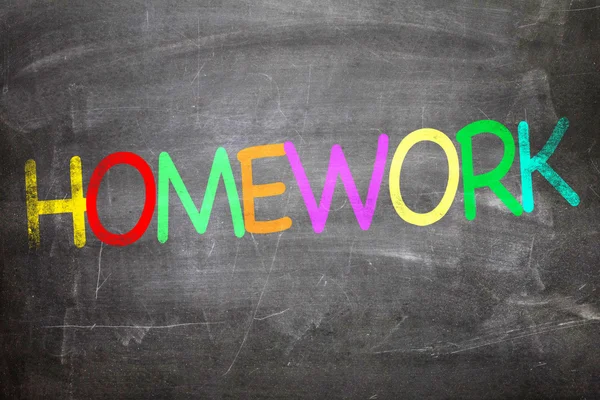 Homework written on a chalkboard — Stock Photo, Image