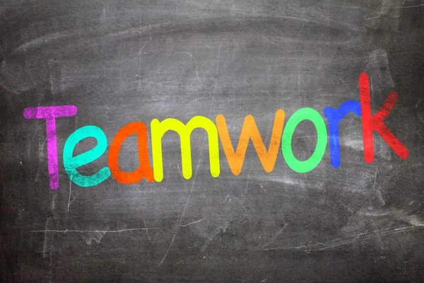 Teamwork written on a chalkboard — Stock Photo, Image