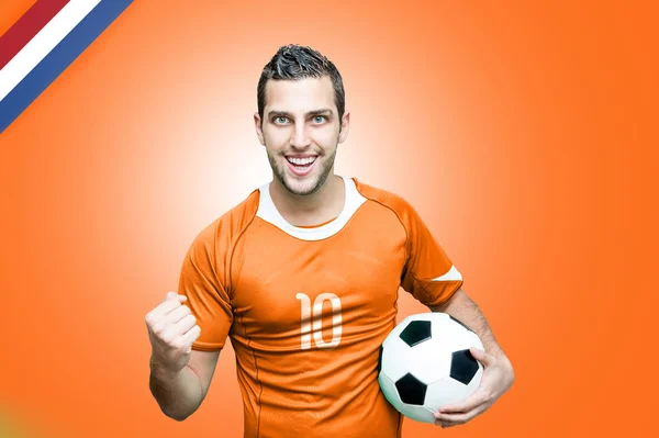 Hollanda fan turuncu arka plan üzerinde kutluyor — Stok fotoğraf