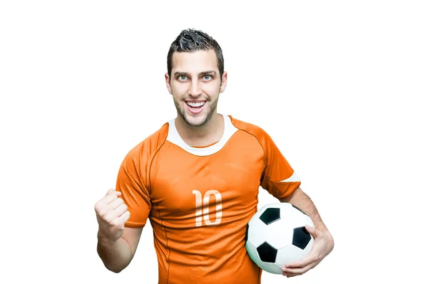 Футбольный фанат празднует с оранжевой футболкой — стоковое фото