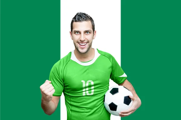 Nigerian fan celebrates on Nigeria flag — Stock Photo, Image