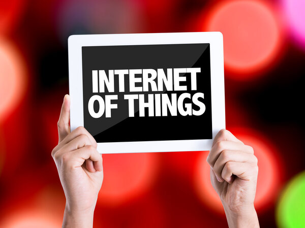 Humans hands holding the tablet