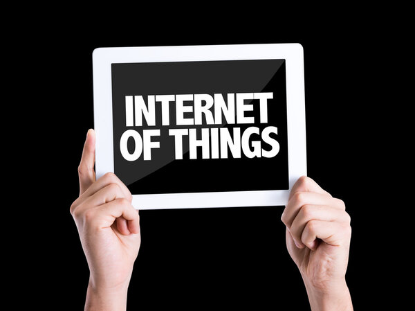 Humans hands holding the tablet