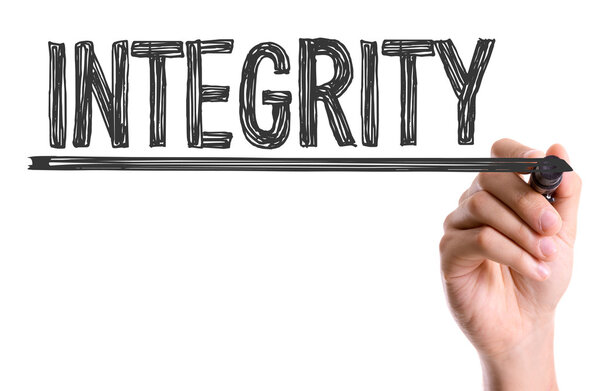 Hand with marker writing the word