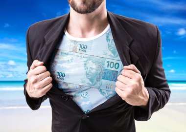 İşadamı Brezilyalı para ile takım elbise germe