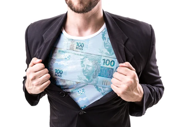 Businessman stretching suit with Brazilian money — Stock Photo, Image