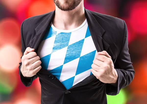 Businessman stretching suit with Bavarian Flag — Stock Photo, Image