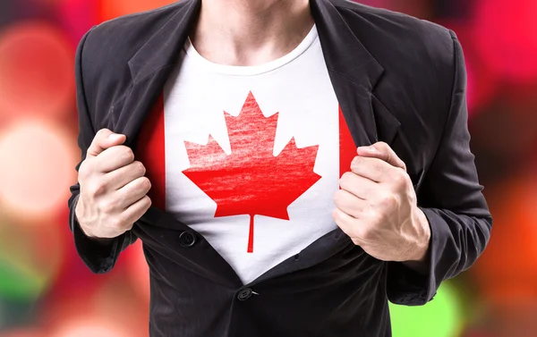 Businessman stretching suit with Canadian flag — Stock Photo, Image