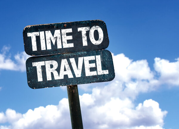 Time To Travel sign with sky background