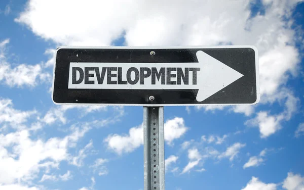 Señal de dirección de desarrollo — Foto de Stock