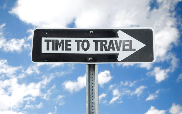 Time To Travel direction sign with sky background