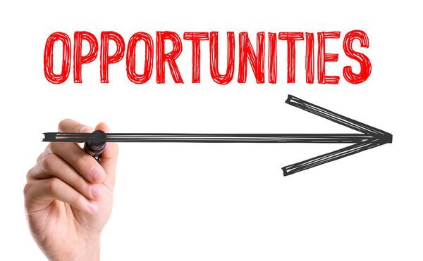 Hand with marker writing text