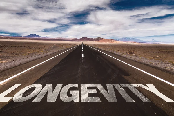Longevity written on road — Stock Photo, Image
