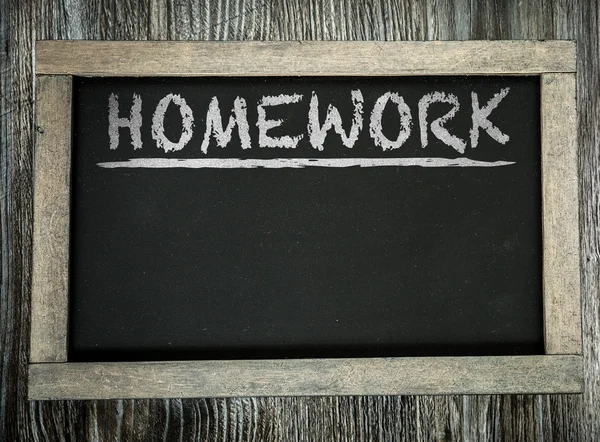 Homework on chalkboard — Stock Photo, Image