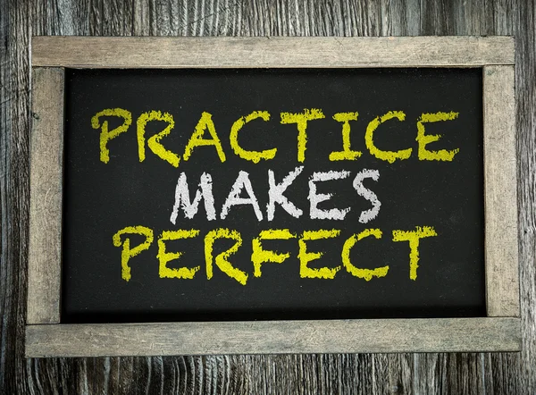 Practice Makes Perfect on chalkboard — Stock Photo, Image