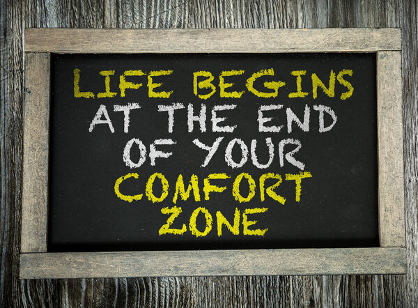 Life Begins At the End of Comfort Zone on chalkboard