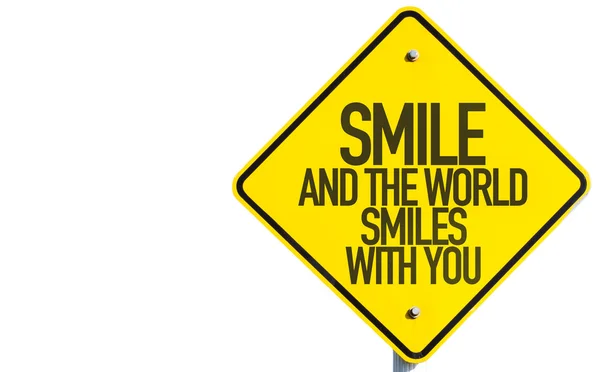 Smil And The World Smiles To You sign — стоковое фото