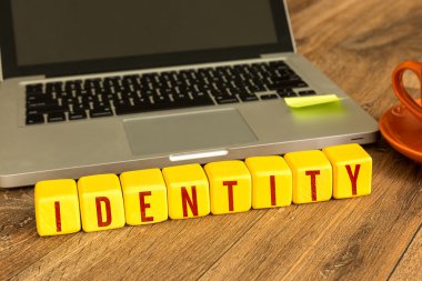 identity written on a wooden cubes clipart