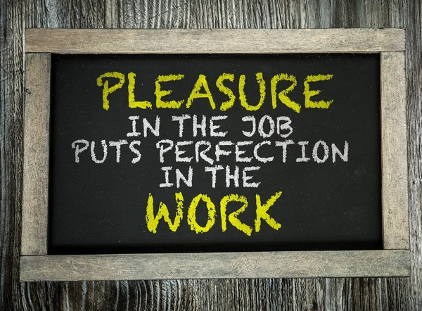 Pleasure in the Job Puts Perfection in the Work on chalkboard — Stock Photo, Image