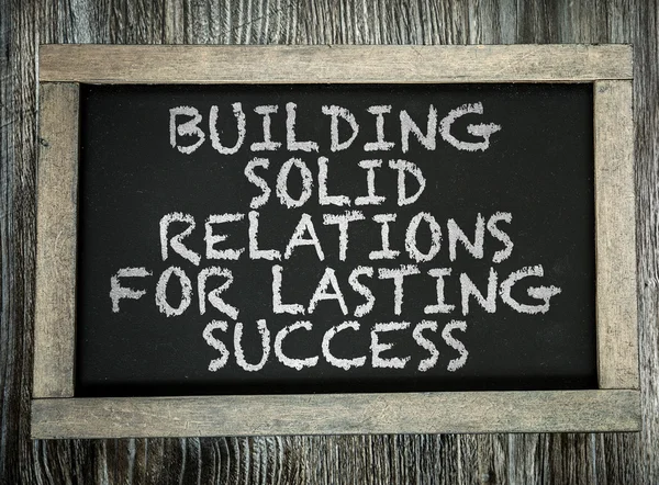 Building Solid Relations on chalkboard — Stock Photo, Image