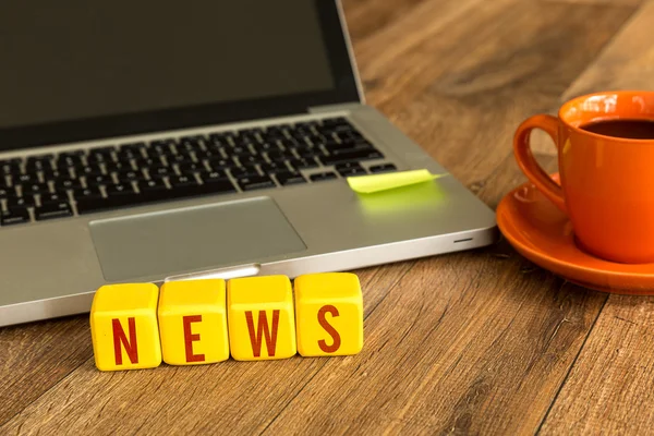 News written on a wooden cubes — Stock Photo, Image