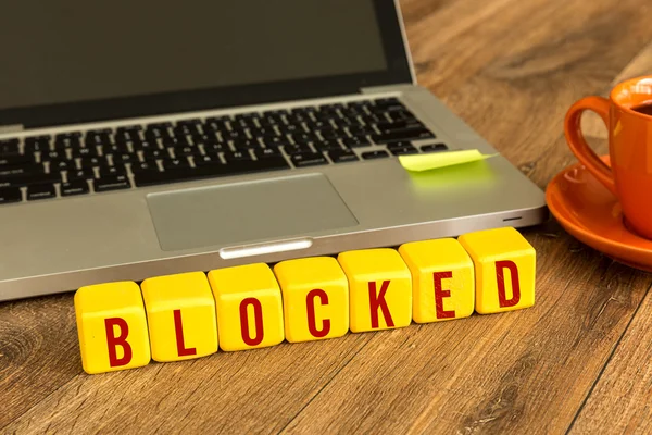 Blocked written on a wooden cubes — Stock Photo, Image