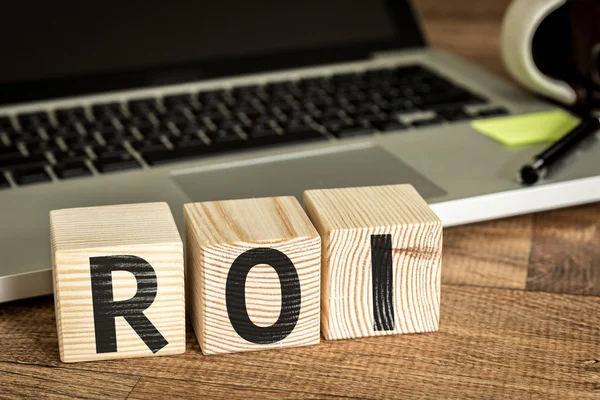 ROI written on a wooden cubes — Stock Photo, Image