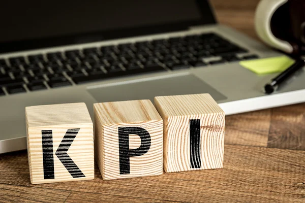 Kpi written on a wooden cubes — Stock Photo, Image