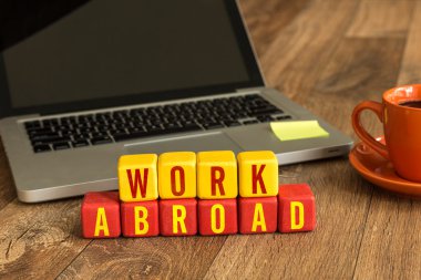 Work Abroad written on cubes clipart