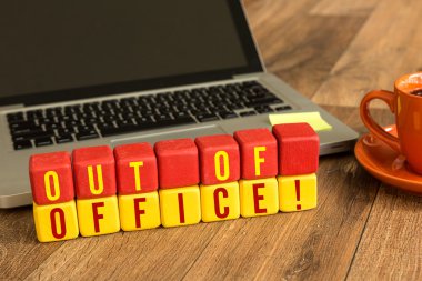 Out of Office written on cubes clipart