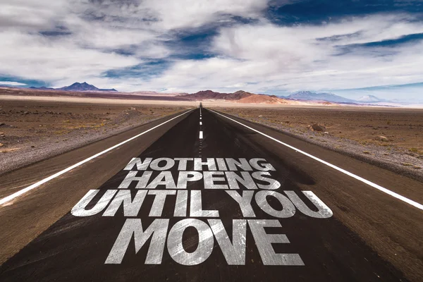 Nothing Happens Until You Move written on road — Stock Photo, Image