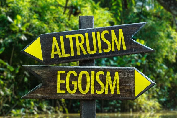 Альтруизм - Egoism signpost — стоковое фото