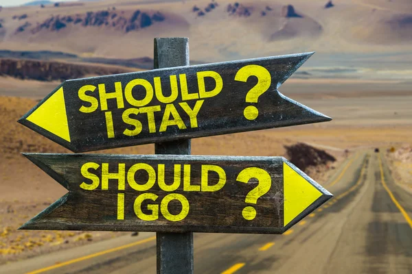 Should I Stay? Should I Go? signpost — Stock Photo, Image