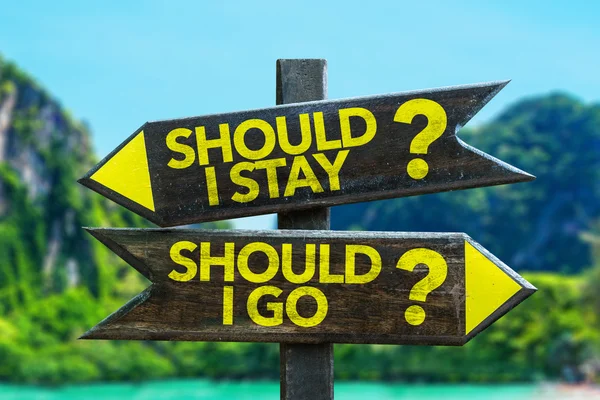 Should I Stay? Should I Go? signpost — Stock Photo, Image