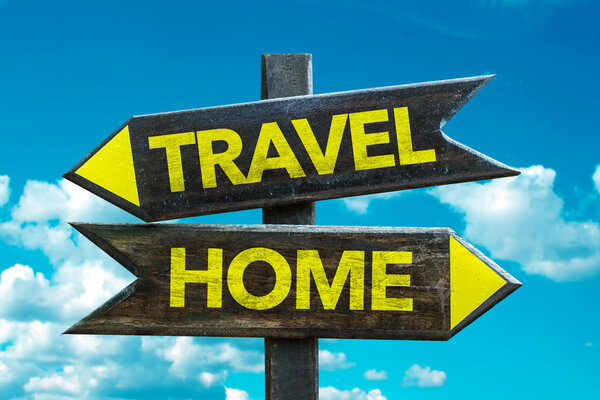 Travel - Home signpost with sky background