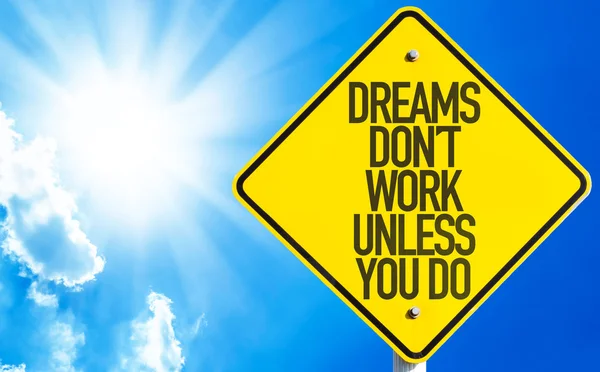 Dreams Don 't Work unless You Do sign — стоковое фото