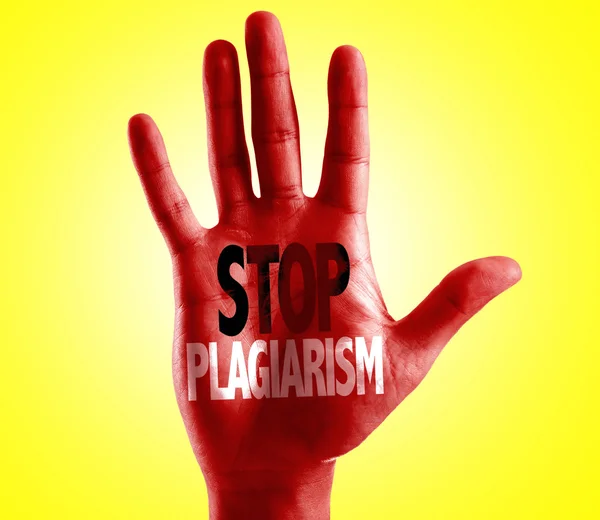 Stop Plagiarism written on hand — Stock Photo, Image