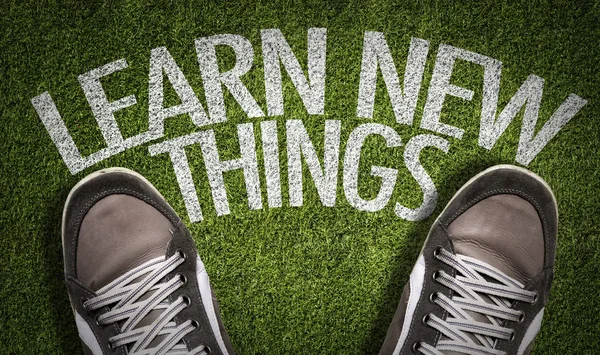 Sneakers on the grass with the text — Stock Photo, Image