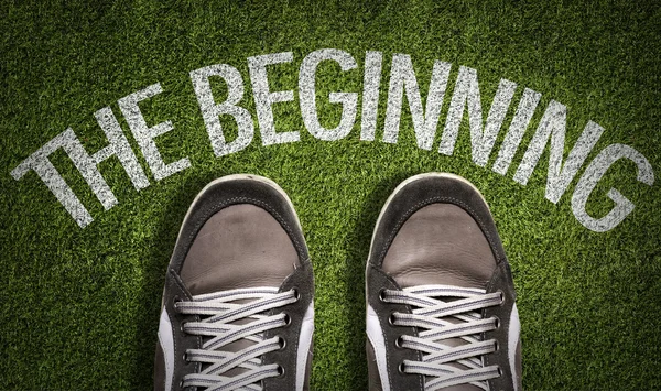 Sneakers on the grass with the text — Stock Photo, Image