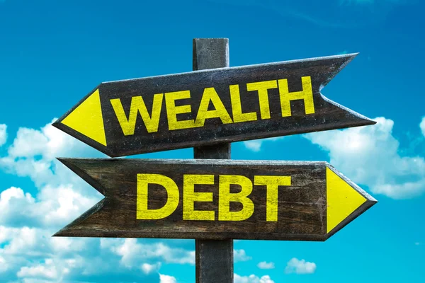 Wealth - Debt signpost — Stock Photo, Image