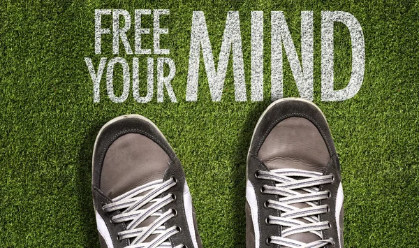 Sneakers on the grass with the text — Stock Photo, Image