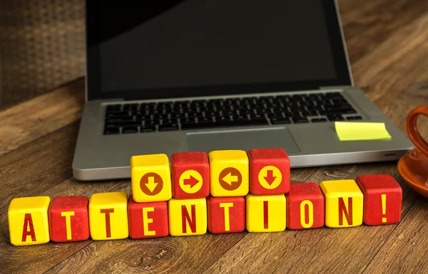 Attention! written on a wooden cubes — Stock Photo, Image