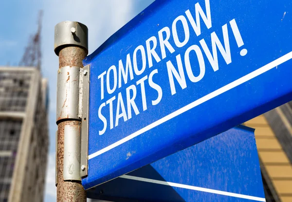 Tomorrow Starts Now! sign — Stock Photo, Image