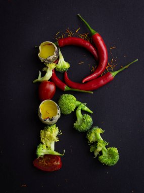 Siyah arkaplanda sebze harfi