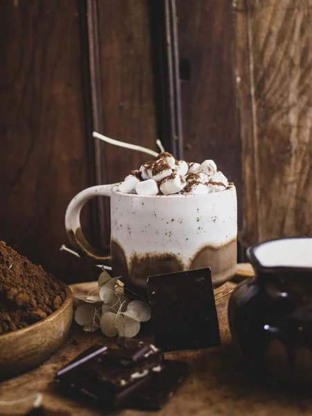 still life with chocolate on a wooden background