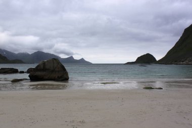 sandy beach in the background of mountains - Uttakleiv (Lofoten)