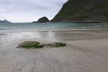 sandy beach in the background of mountains - Uttakleiv (Lofoten)