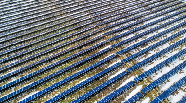 Top view of solar panels field solar cell from above. Alternative energy, ecology power conservation concept. Aerial view.