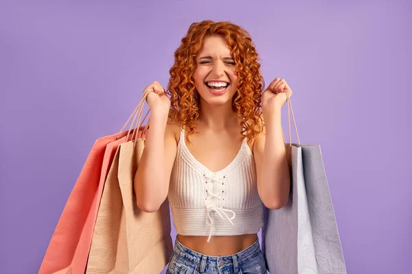 Cute Contented Red Haired Girl Curls Shopping Bags Isolated Purple — Stock Photo, Image