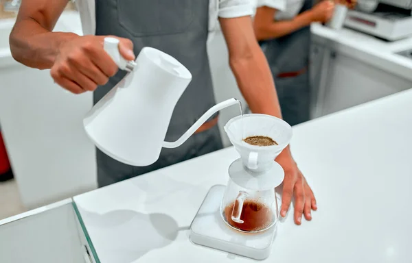 Hand drip coffee, Barista making drip coffee. Barista brewing coffee, method pour over, drip coffee.